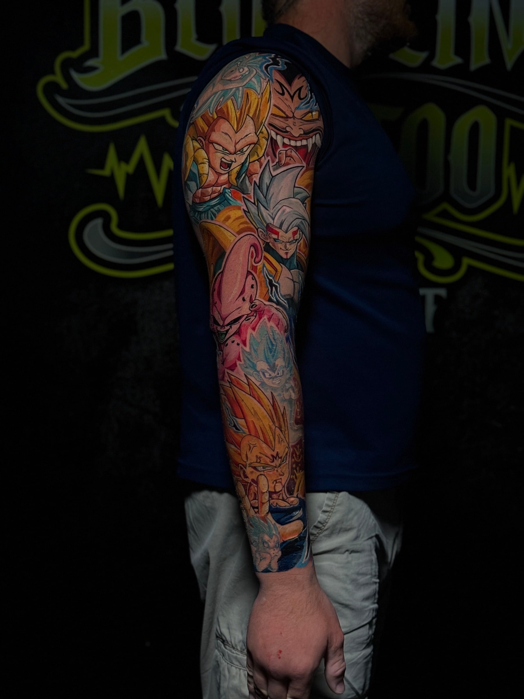 Dragon Ball anime colour full sleeve with Majin Vegeta, Majin Buu, and Super Saiyan characters in bold saturated tones at Bloodline Tattoo Phuket.